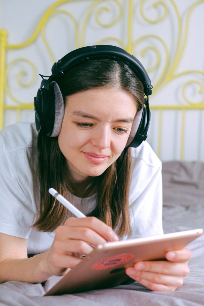 student writing/annotating on an iPad or tablet