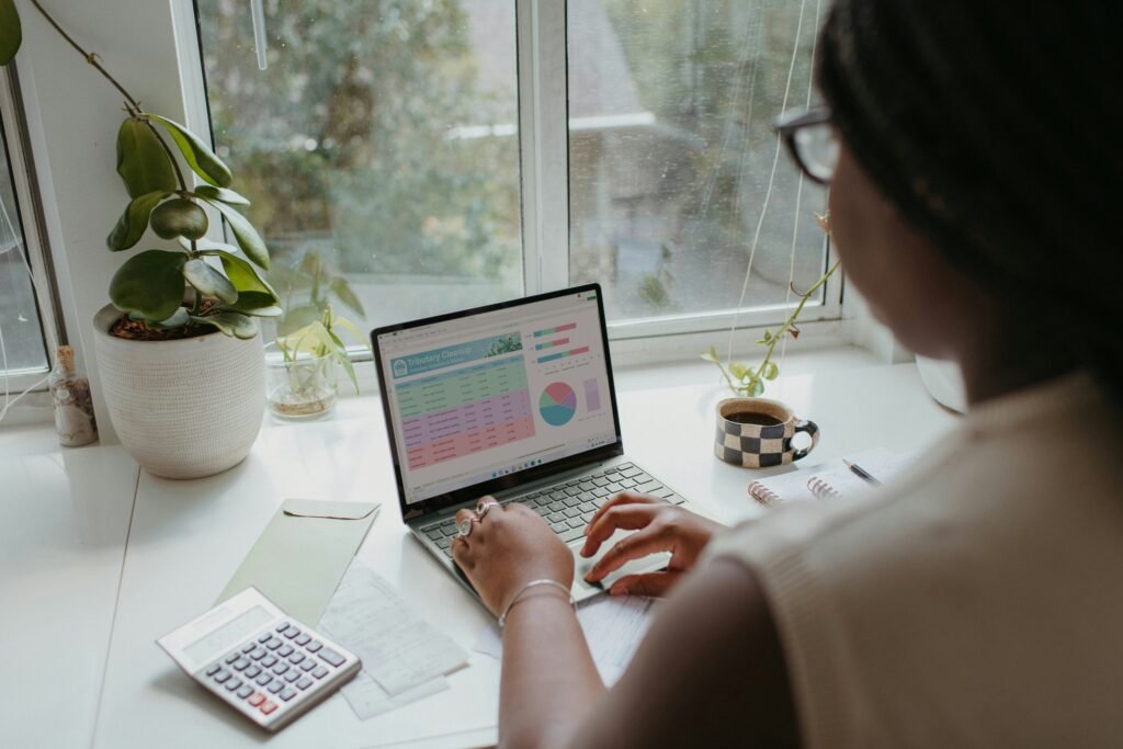A flat-lay or desk photo showing a laptop, phone, and notebook — sets the "student workspace" tone for the article
