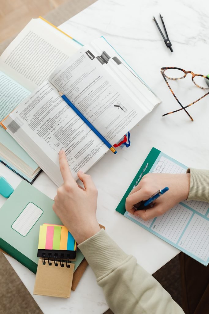 NAPLEX study resources laid out on a desk